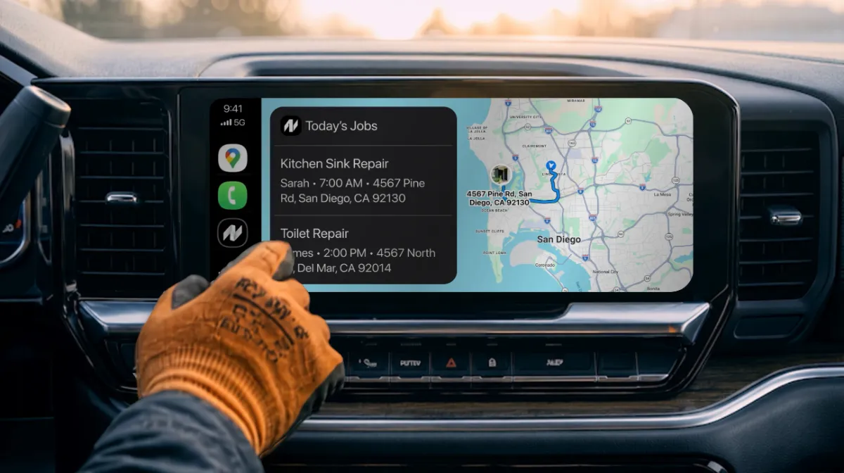 A pro in work gloves tapping today's jobs on NextPros in Apple CarPlay, with the route on the map